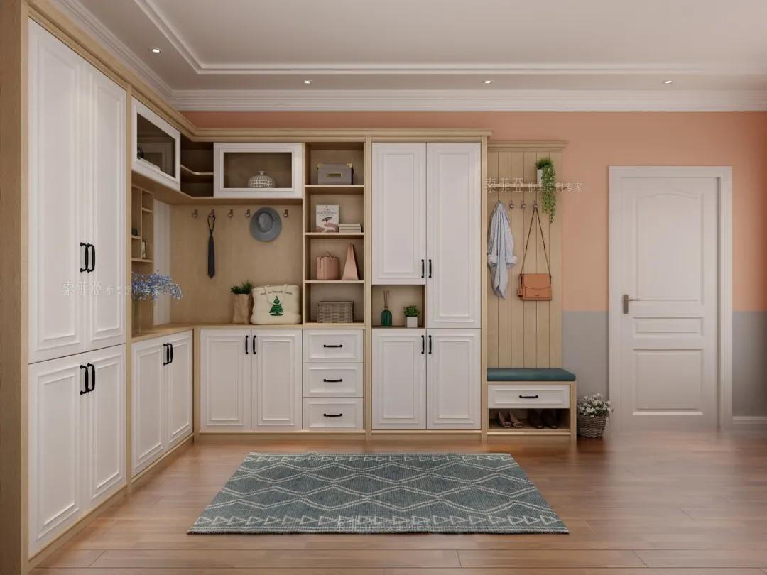 进门之后有个拐角,就能把墙面空间利用起来,定制一个两面的l型玄关柜