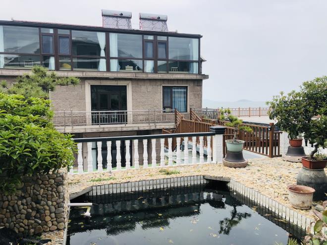 山东青岛崂山幸福海边民宿位于崂山仰口景区白云洞和华严寺山脚下