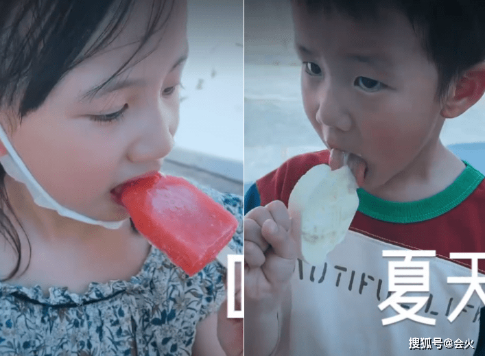 孙莉带孩子逛公园 儿子在一旁狂吃零食
