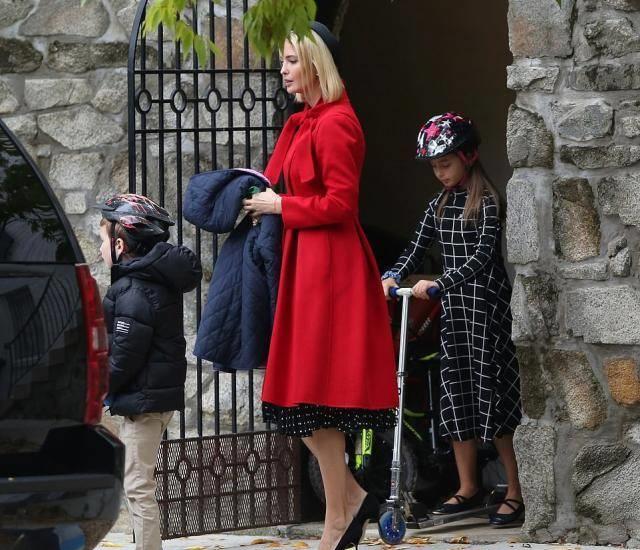 依旧是造型感满分的一天,伊万卡黑色小礼帽搭配红色收腰裙太有看点