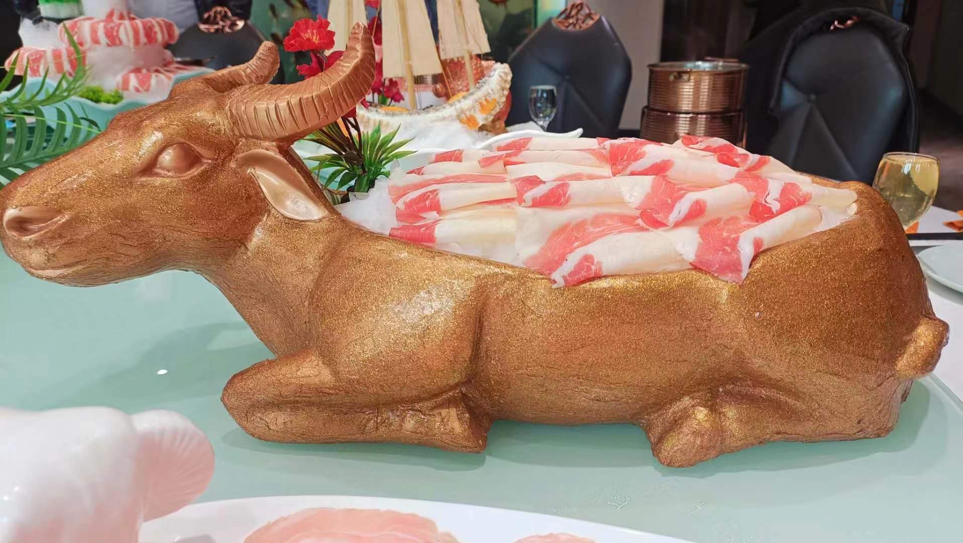 图为澳洲肥牛店"金羊食尊" 造型会议形成2024年大汶口文化食文化课题