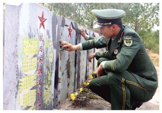 一座苗家风雨桥横跨在长坪河上,桥边就是红军长征烈士纪念碑