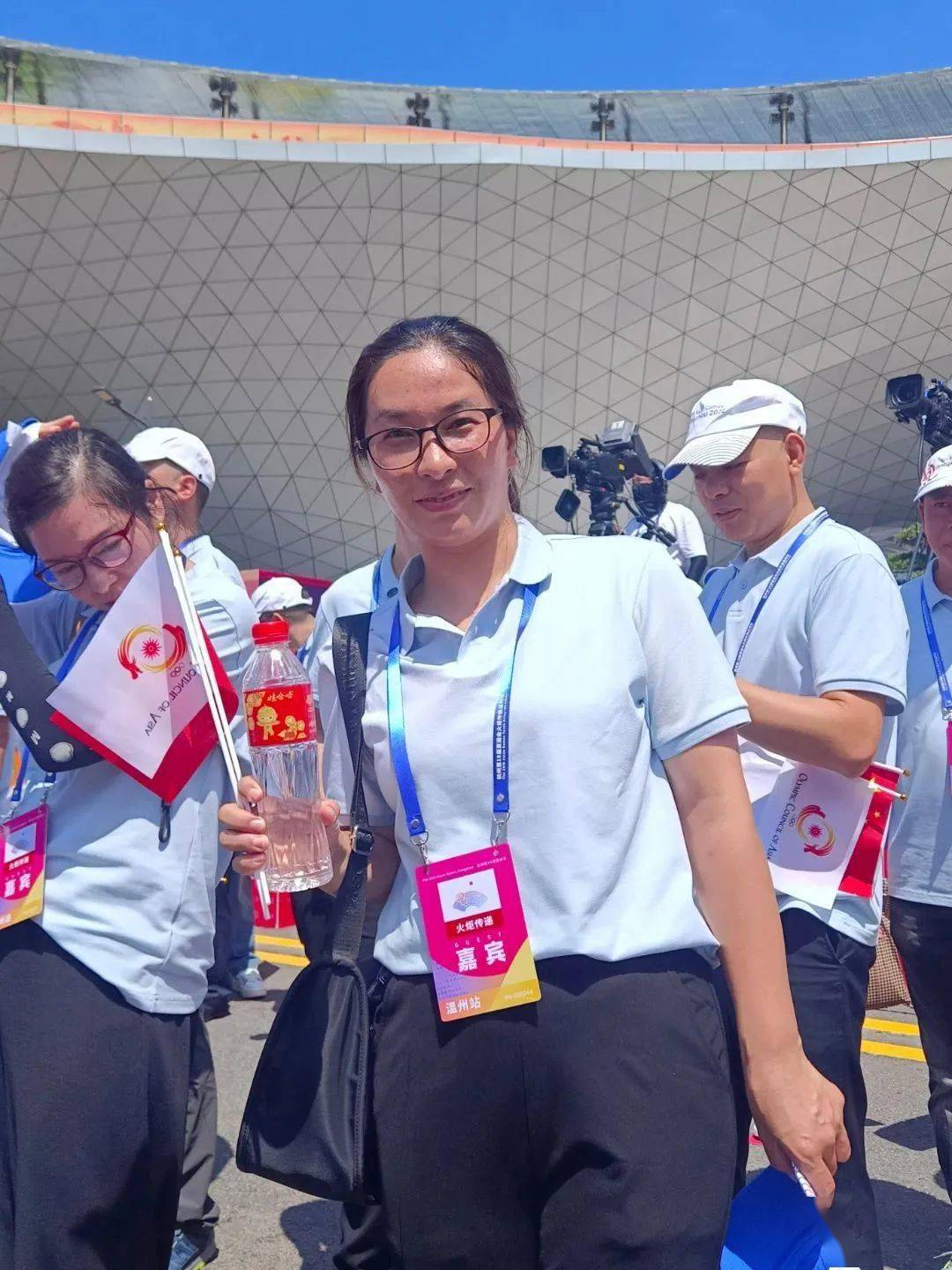 第10棒火炬手,温州市个体劳动者协会副会长章华妹_经济_亚运会_浙江